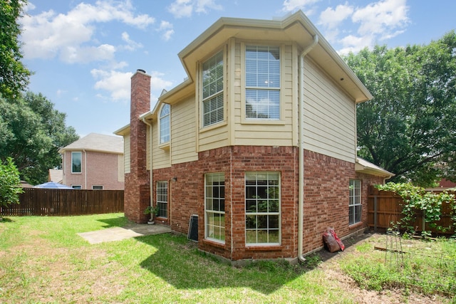 3010 Partridge Ln, Mckinney, TX 75072 - back of house with a fenced backyard and brick siding