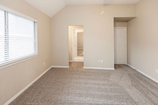 1823 Bristol Ln, Rockwall, TX 75032 - unfurnished bedroom featuring carpet floors, lofted ceiling, and baseboards