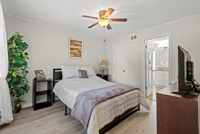 1407 S Alamo Rd, Rockwall, TX 75087 - bedroom with light wood-style floors, ornamental molding, ensuite bath, baseboards, and a ceiling fan