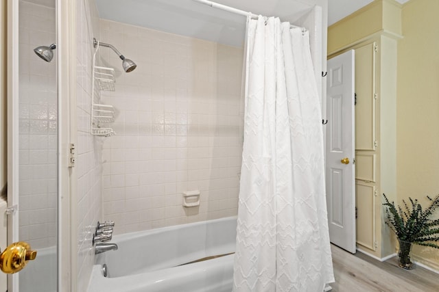 1407 S Alamo Rd, Rockwall, TX 75087 - bathroom featuring shower / bath combo with shower curtain and wood finished floors