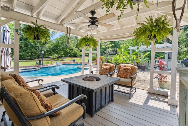 1407 S Alamo Rd, Rockwall, TX 75087 - outdoor pool featuring an outdoor living space with a fire pit, ceiling fan, and a deck
