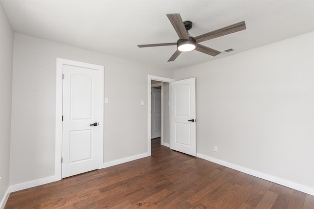 1024 Tower St, Canton, TX 75103 - unfurnished bedroom with baseboards and dark wood-type flooring