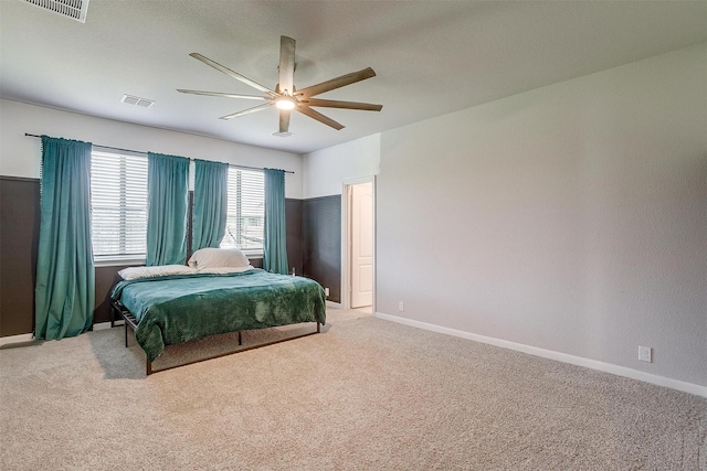 1112 Goldenrod Dr, Godley, TX 76044 - bedroom with light colored carpet, a ceiling fan, and baseboards