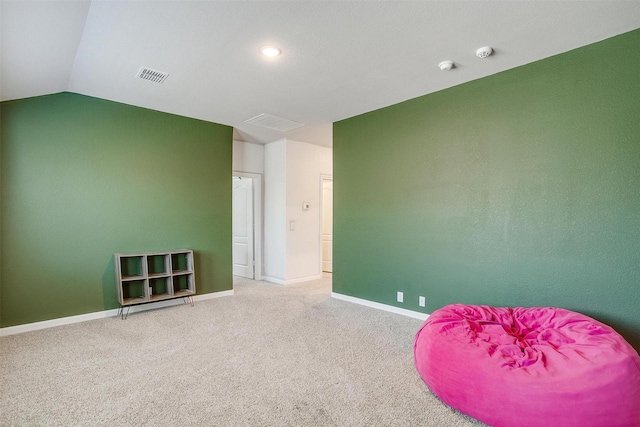 1112 Goldenrod Dr, Godley, TX 76044 - living area featuring carpet floors, vaulted ceiling, and baseboards