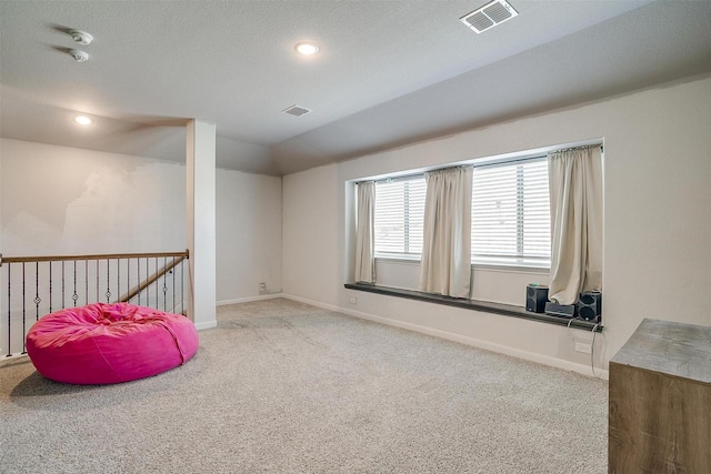 1112 Goldenrod Dr, Godley, TX 76044 - sitting room with carpet floors, lofted ceiling, baseboards, recessed lighting, and an upstairs landing
