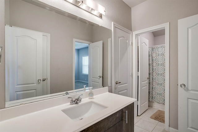 1112 Goldenrod Dr, Godley, TX 76044 - bathroom featuring vanity, tile patterned flooring, and curtained shower