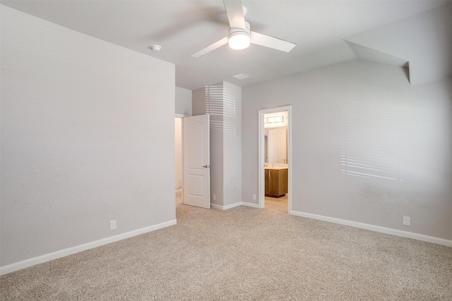 1112 Goldenrod Dr, Godley, TX 76044 - unfurnished bedroom featuring light carpet, baseboards, ensuite bathroom, a ceiling fan, and lofted ceiling