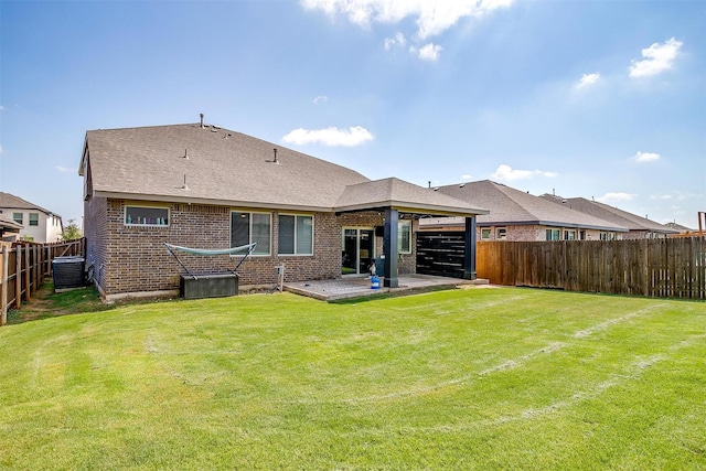 1112 Goldenrod Dr, Godley, TX 76044 - back of house with brick siding, central air condition unit, a patio, a shingled roof, and an attached garage