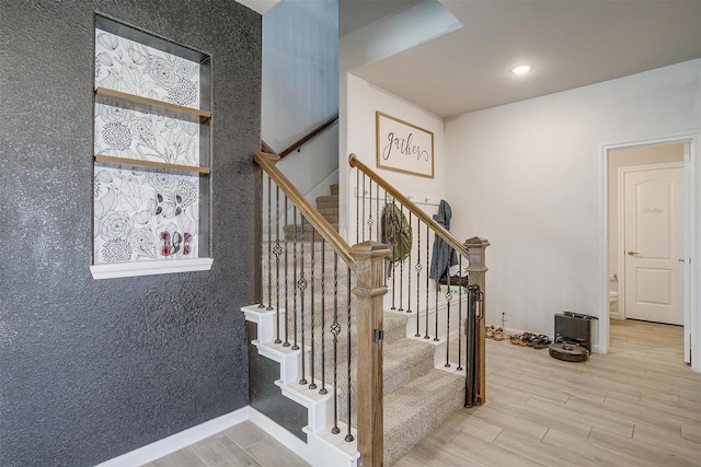 1112 Goldenrod Dr, Godley, TX 76044 - staircase with wood finished floors and recessed lighting