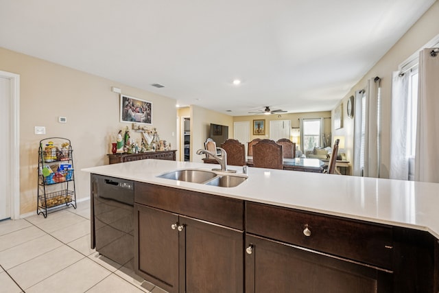 3350 Margay Run, Crandall, TX 75114 - kitchen with a sink, dishwasher, dark brown cabinetry, and light countertops