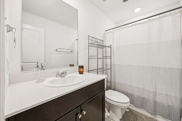3350 Margay Run, Crandall, TX 75114 - full bathroom with vanity, toilet, and tile patterned floors