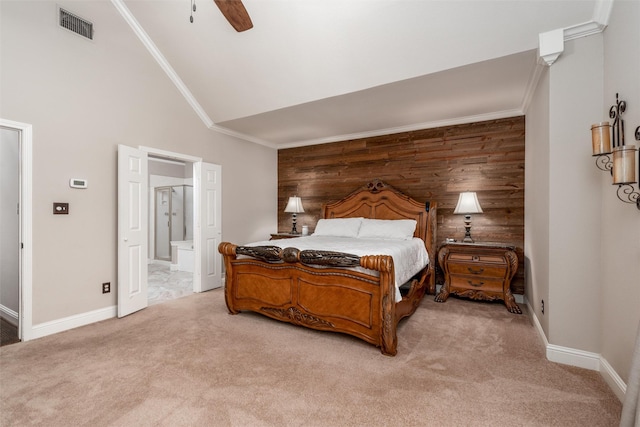 24 Shady Dale Ln, Rockwall, TX 75032 - bedroom with light colored carpet, wooden walls, baseboards, connected bathroom, and crown molding
