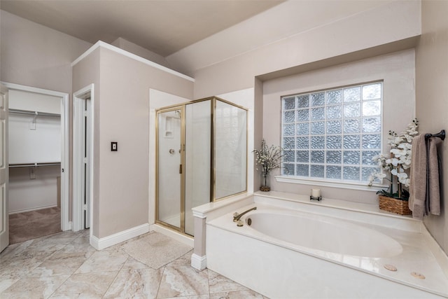 24 Shady Dale Ln, Rockwall, TX 75032 - full bath with a bath, a stall shower, a walk in closet, lofted ceiling, and baseboards