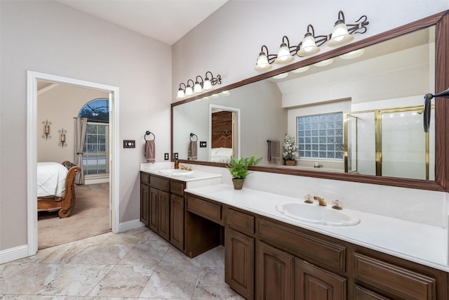 24 Shady Dale Ln, Rockwall, TX 75032 - ensuite bathroom with double vanity, baseboards, and a shower with shower door