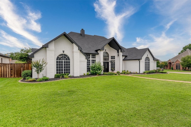 24 Shady Dale Ln, Rockwall, TX 75032 - french country inspired facade with a chimney, brick siding, and roof with shingles