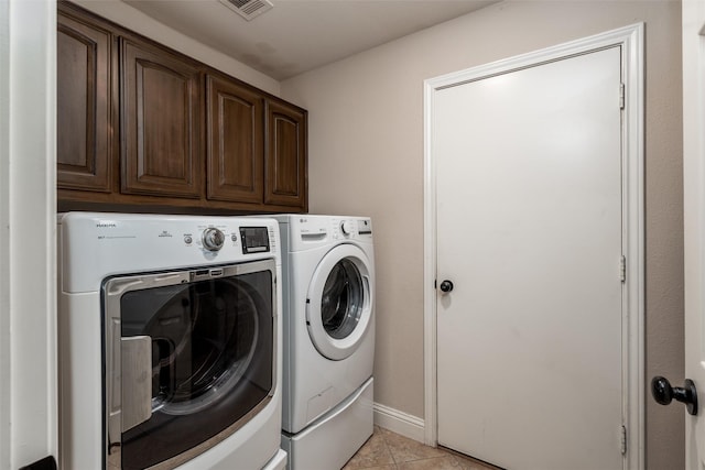 24 Shady Dale Ln, Rockwall, TX 75032 - laundry room with independent washer and dryer, cabinet space, light tile patterned flooring, and baseboards