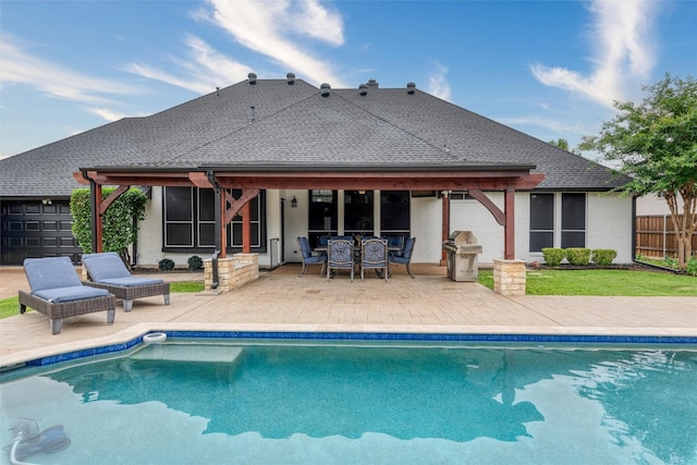 24 Shady Dale Ln, Rockwall, TX 75032 - back of property featuring an outdoor pool, a patio, outdoor dining area, and brick siding