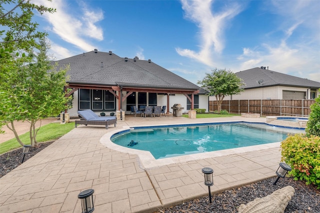 24 Shady Dale Ln, Rockwall, TX 75032 - view of swimming pool with a patio, grilling area, and a pool with connected hot tub