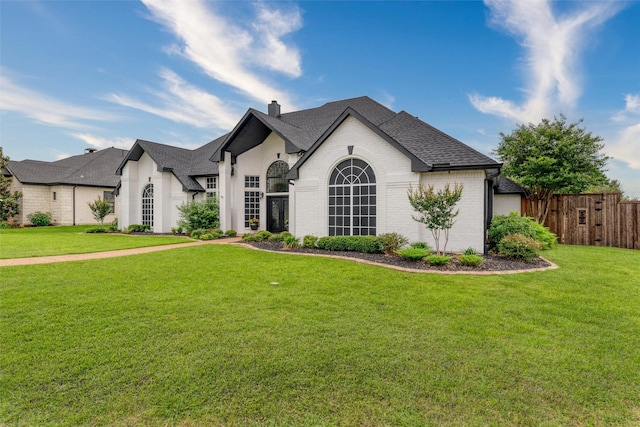 24 Shady Dale Ln, Rockwall, TX 75032 - french country inspired facade with a chimney, brick siding, and a shingled roof