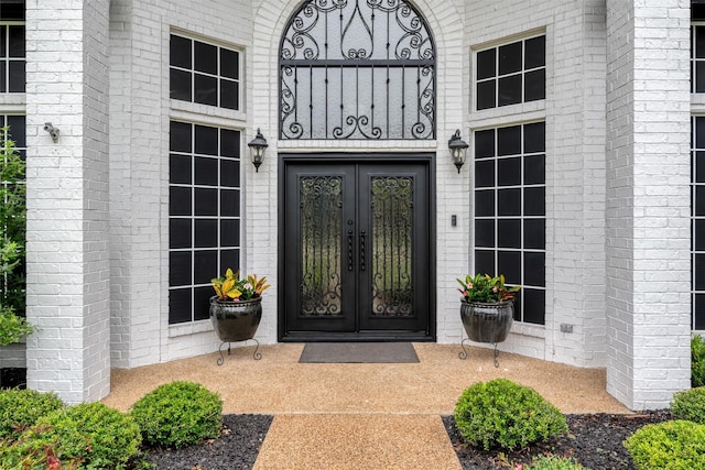24 Shady Dale Ln, Rockwall, TX 75032 - property entrance featuring french doors and brick siding