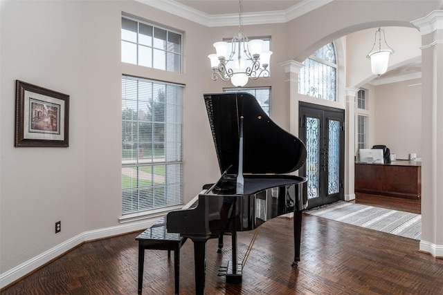 24 Shady Dale Ln, Rockwall, TX 75032 - entrance foyer with plenty of natural light, decorative columns, a chandelier, baseboards, and crown molding
