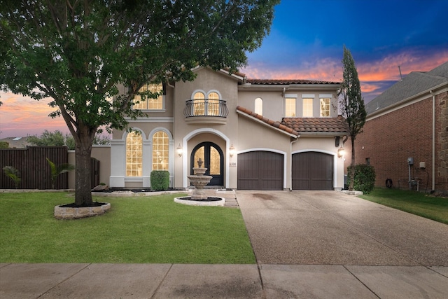 6500 Lazy Oak Ln, Plano, TX 75024 - mediterranean / spanish home featuring a balcony, driveway, stucco siding, a tiled roof, and an attached garage