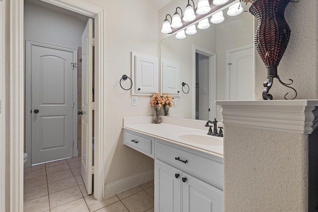 6500 Lazy Oak Ln, Plano, TX 75024 - bathroom with tile patterned floors, vanity, toilet, and baseboards