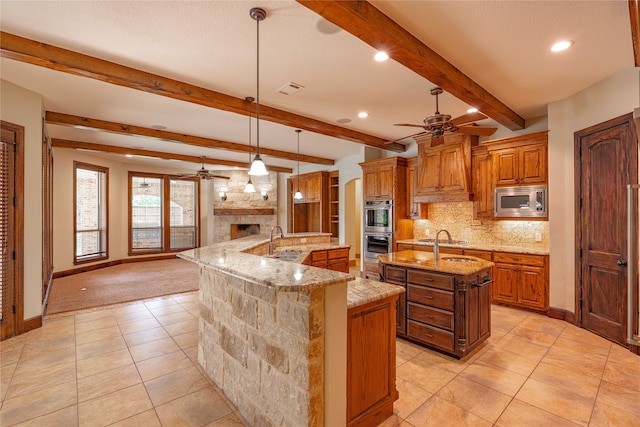 2454 Savanna Cir, Midlothian, TX 76065 - kitchen featuring ceiling fan, a spacious island, appliances with stainless steel finishes, a sink, and recessed lighting