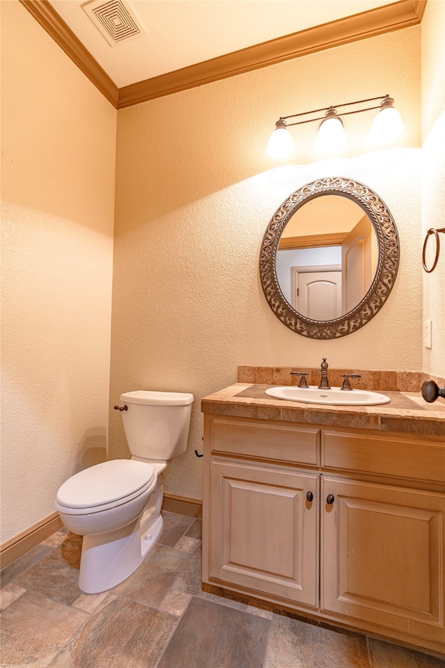 2454 Savanna Cir, Midlothian, TX 76065 - half bath with toilet, stone finish flooring, vanity, baseboards, and crown molding
