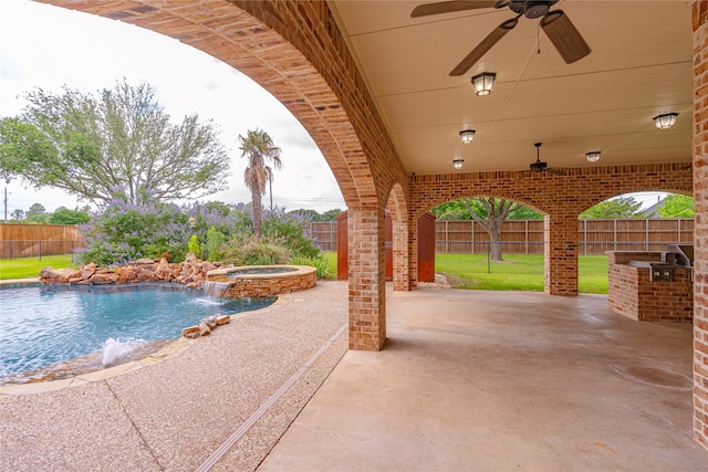 2454 Savanna Cir, Midlothian, TX 76065 - view of patio with a ceiling fan, a pool with connected hot tub, and exterior kitchen