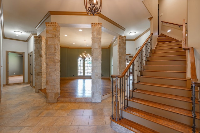 2454 Savanna Cir, Midlothian, TX 76065 - stairs featuring ornate columns, ornamental molding, a chandelier, and baseboards
