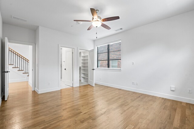4133 Emerson Ave Unit 1, University Park, TX 75205 - unfurnished bedroom with baseboards, light wood-type flooring, and ceiling fan