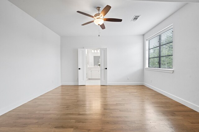 4133 Emerson Ave Unit 1, University Park, TX 75205 - unfurnished room featuring ceiling fan, wood finished floors, and baseboards