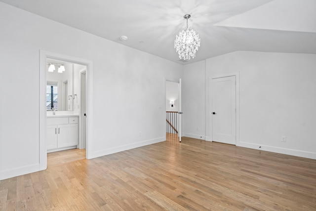 4133 Emerson Ave Unit 1, University Park, TX 75205 - spare room featuring a chandelier, light wood-style floors, lofted ceiling, baseboards, and a smoke detector