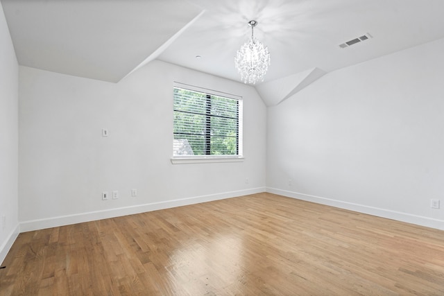 4133 Emerson Ave Unit 1, University Park, TX 75205 - bonus room with a chandelier, baseboards, light wood finished floors, and lofted ceiling