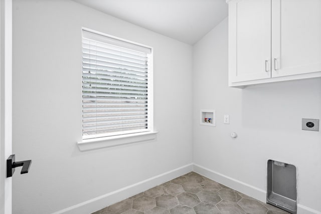 4133 Emerson Ave Unit 1, University Park, TX 75205 - laundry room with cabinet space, hookup for a washing machine, electric dryer hookup, baseboards, and hookup for a gas dryer