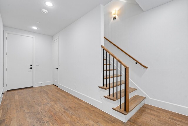 4133 Emerson Ave Unit 1, University Park, TX 75205 - foyer with wood finished floors, recessed lighting, baseboards, and stairway