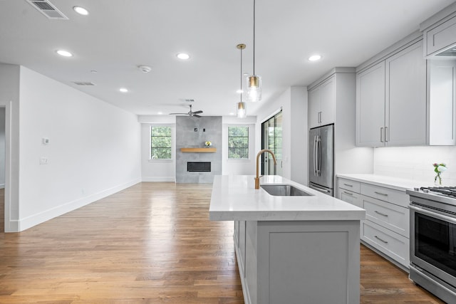 4133 Emerson Ave Unit 1, University Park, TX 75205 - kitchen with a sink, stainless steel appliances, open floor plan, gray cabinets, and a ceiling fan