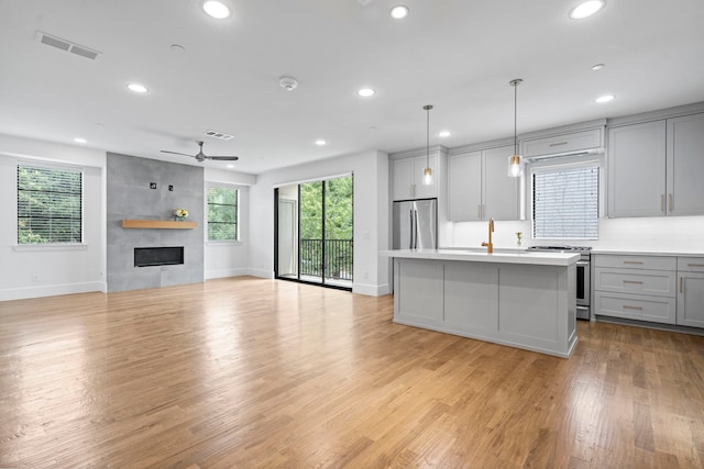 4133 Emerson Ave Unit 1, University Park, TX 75205 - kitchen featuring stainless steel appliances, gray cabinets, recessed lighting, baseboards, and ceiling fan