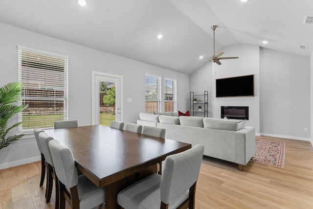 10650 Barrington Ln, Fort Worth, TX 76126 - dining room featuring vaulted ceiling, light wood-style flooring, recessed lighting, a ceiling fan, and a glass covered fireplace