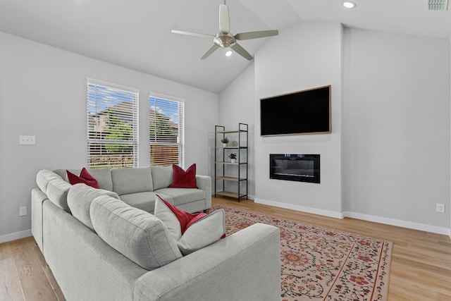10650 Barrington Ln, Fort Worth, TX 76126 - living area with lofted ceiling, ceiling fan, light wood-style floors, recessed lighting, and a glass covered fireplace