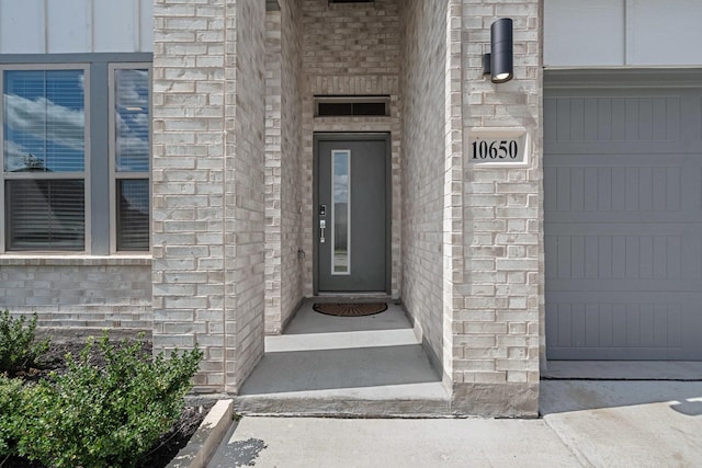 10650 Barrington Ln, Fort Worth, TX 76126 - view of exterior entry with brick siding and an attached garage