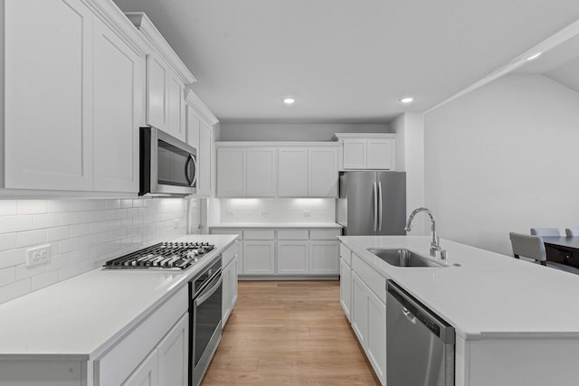 10650 Barrington Ln, Fort Worth, TX 76126 - kitchen featuring appliances with stainless steel finishes, recessed lighting, white cabinets, light countertops, and decorative backsplash