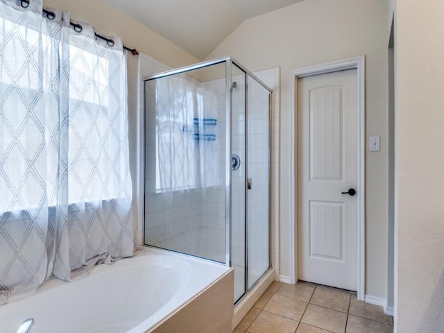 1071 Shepard Ln, Lavon, TX 75166 - bathroom with a shower stall, a garden tub, tile patterned floors, lofted ceiling, and baseboards