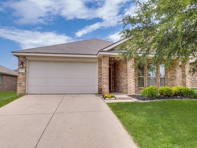 1071 Shepard Ln, Lavon, TX 75166 - ranch-style home featuring concrete driveway, brick siding, a front yard, and an attached garage