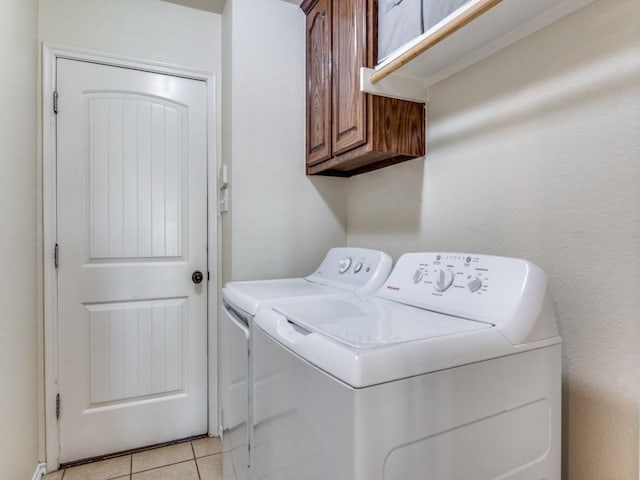 1071 Shepard Ln, Lavon, TX 75166 - washroom with cabinet space, washing machine and dryer, and light tile patterned floors