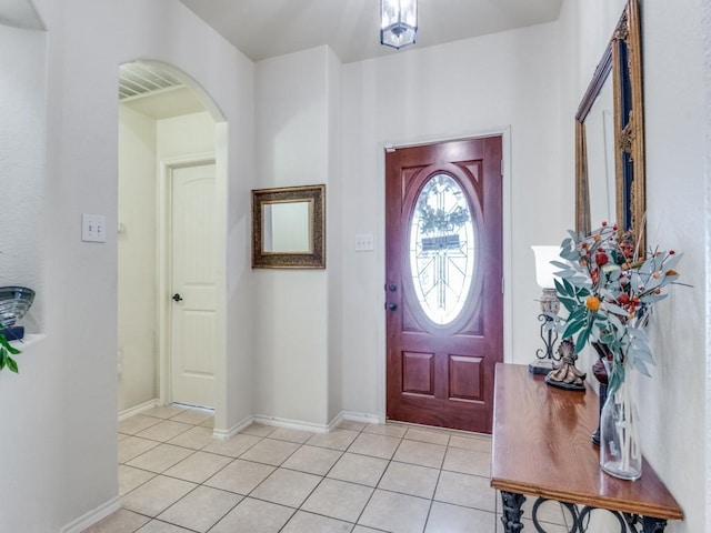 1071 Shepard Ln, Lavon, TX 75166 - foyer entrance with arched walkways, light tile patterned floors, and baseboards