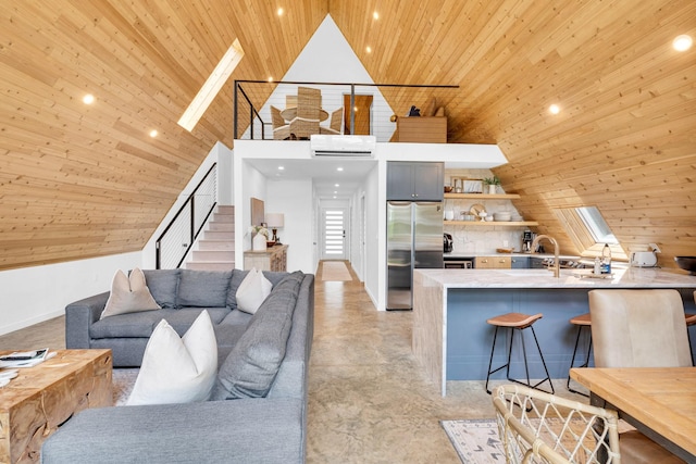 1223 Whispering Springs Dr, Tool, TX 75143 - living area with wood ceiling, concrete floors, stairway, a wall mounted AC, and high vaulted ceiling