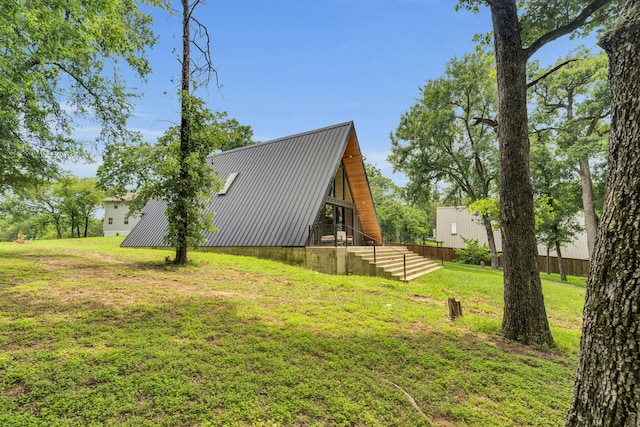 1223 Whispering Springs Dr, Tool, TX 75143 - view of side of home featuring metal roof and a lawn
