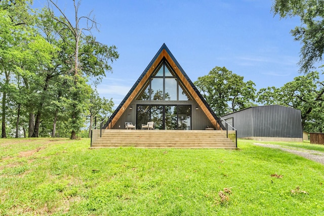 1223 Whispering Springs Dr, Tool, TX 75143 - rear view of house with an outbuilding, an outdoor structure, and a yard